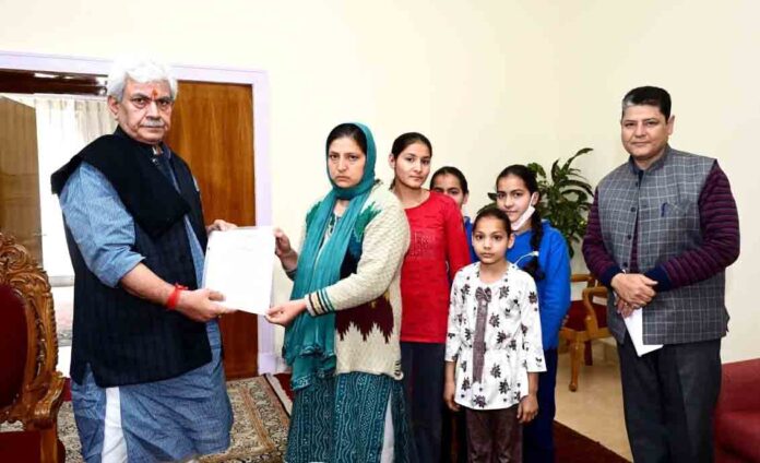 Lt Governor hands over appointment letter to martyr civilian Suneel Pandith’s wife